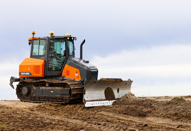 Develon wiellader op zachte ondergrond